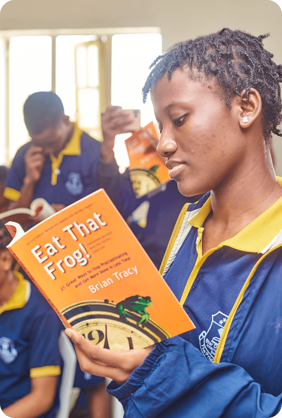 Student focused on reading in class